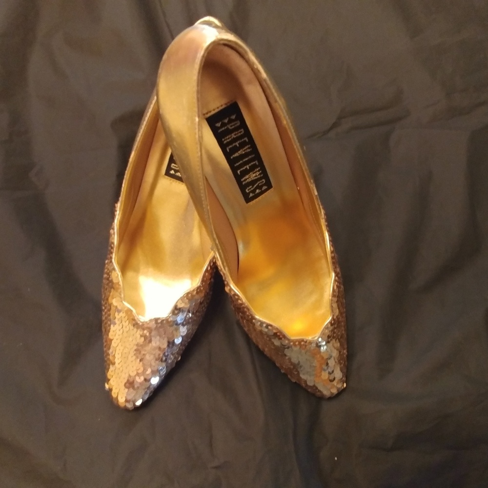 One pair of Gold sequence heels. One Gold sequence